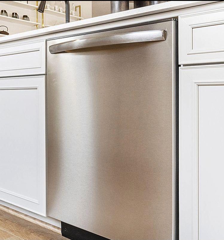 Built-in dishwasher being repaired by a licensed technician
